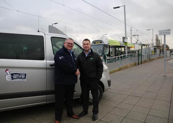 iDEAL CARS director, Ian Brough (left) and NET marketing manager, Jamie Swift (right) at Hucknall tram stop.