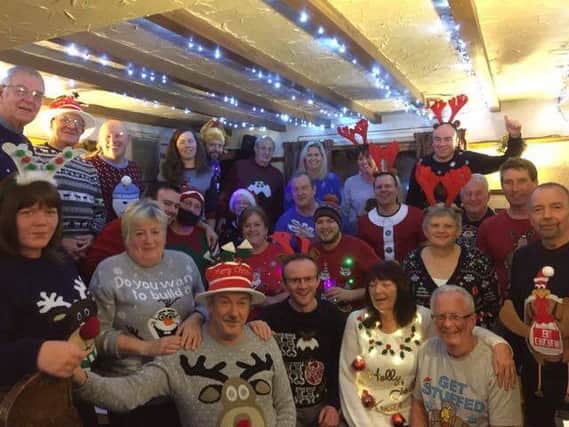 26 people wore different Christmas jumpers at The Grapes pub in Belper, Derbyshire Can you beat their record?