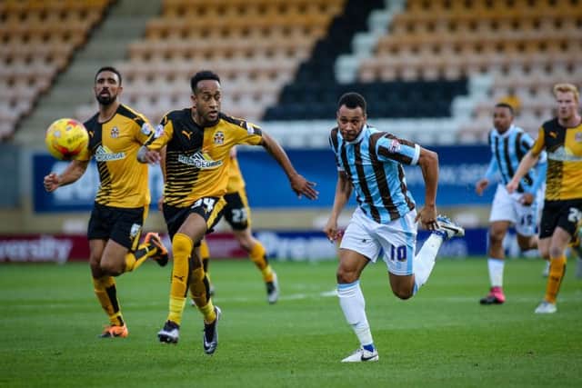 Mansfield Town's Matt Green takes on the Cambridge defence. Pics by Chris Holloway