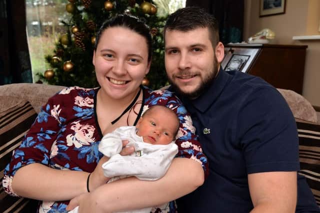 Christmas Day baby Bobby Rae Cox pictured at home with Mum Kacia Gaughan and Dad Robert Cox