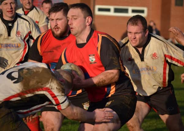 STOPPED IN HIS TRACKS -- a powerful charge by Reece Courtney is halted by Sleafords strong defence during Ashfields 22-15 defeat in the Midlands 3 East (North) division of the National League on Saturday.