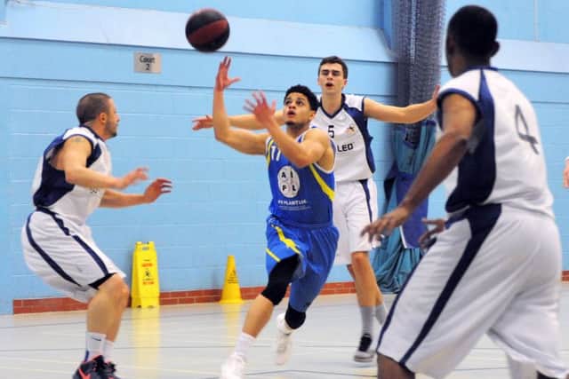 THRILLER -- action from Mansfield Giants' entertaining clash with Sefton Stars at the Oak Tree Leisure Centre.