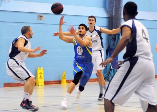 THRILLER -- action from Mansfield Giants' entertaining clash with Sefton Stars at the Oak Tree Leisure Centre.
