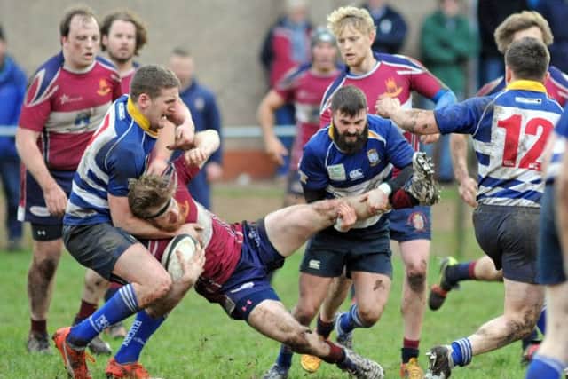 ROUGH AND TUMBLE -- action from Mansfield RUFC's disappointing defeat at home to Southwell.