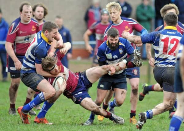 ROUGH AND TUMBLE -- action from Mansfield RUFC's disappointing defeat at home to Southwell.