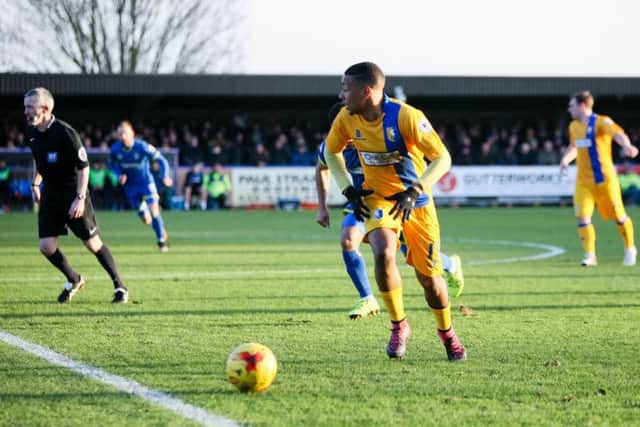Mansfield Town's Reggie LAmbe looks to make the pass - Pic by Chris Holloway