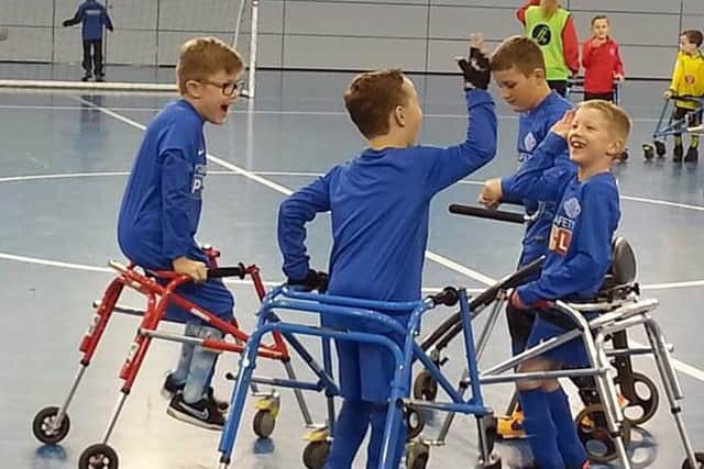 High fives: from left, Luke Campey, Logan Scothern, Jack Morton, Reid Radburn.