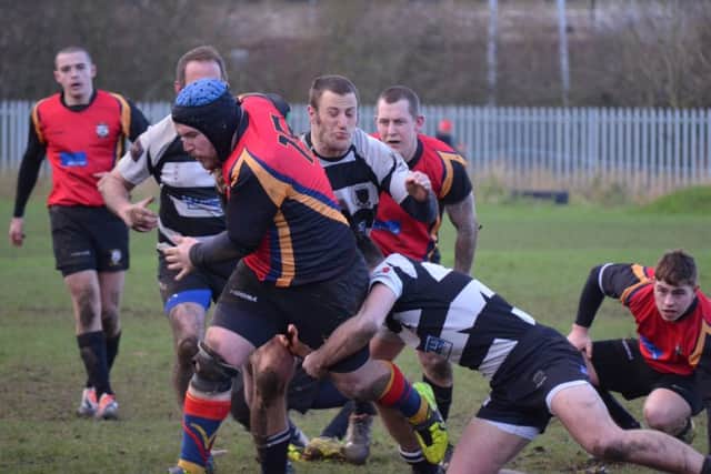 PLOUGHING A LONE FURROW -- Andy Bennett tries to make ground during Ashfield's crushing defeat at home to Belper.