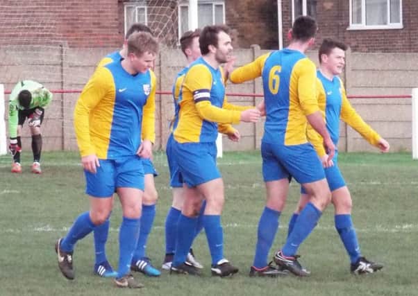 GOAL! -- Teversal celebrate their opening goal on their way to victory at Worsbrough Bridge.