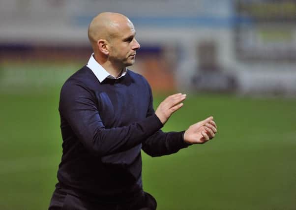 Manager Adam Murray applaudes the fans after the win over Stevenage.