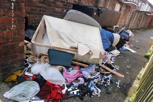 Fly-tipping mess to the rear of properties on Victoria Street, Mansfield, for which the Council  want the residents to pay for clear-up.
