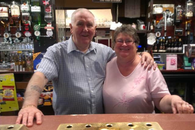 Jeff and Jenny Booth behind the bar at Boothy's.