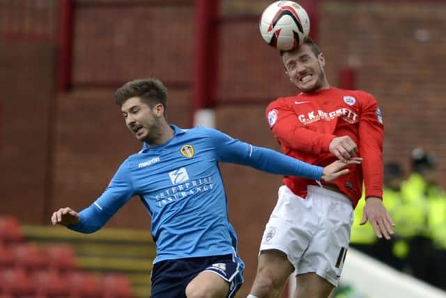 Sky Bet Championship League Football - Barnsley FC v Leeds UTD
Liam Lawrence heads up against Luke Murphy