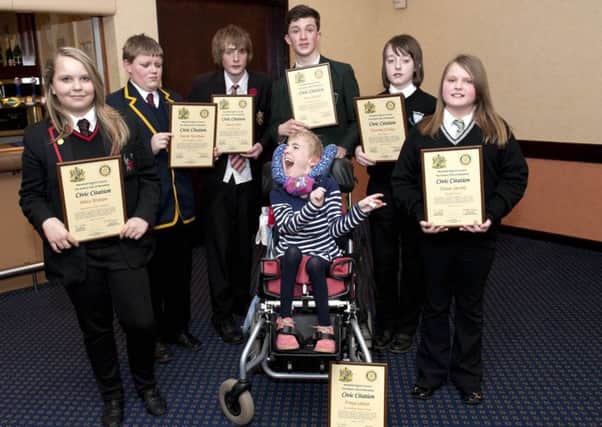 Children of courage at a previous Mansfield Rotary Club ceremony.
