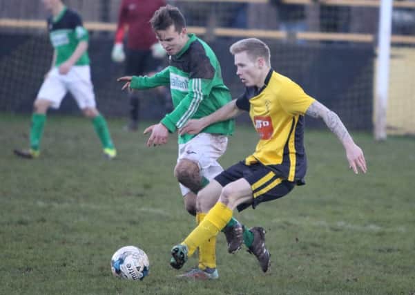 ACTION from Belper United's 4-1 defeat at Hucknall Town.