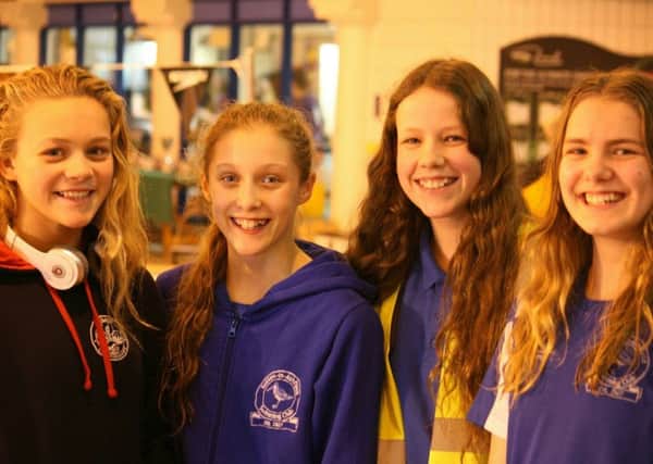 PRIDE OF SUTTON -- four girls who represented Sutton Swimming Club at the county championships, (from left) Chloe Quinn, Ellie Read, Heather Edwards and Nicola Peach.