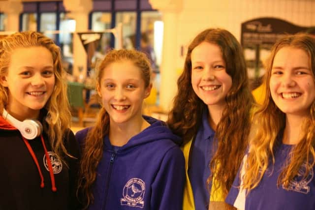 PRIDE OF SUTTON -- four girls who represented Sutton Swimming Club at the county championships, (from left) Chloe Quinn, Ellie Read, Heather Edwards and Nicola Peach.