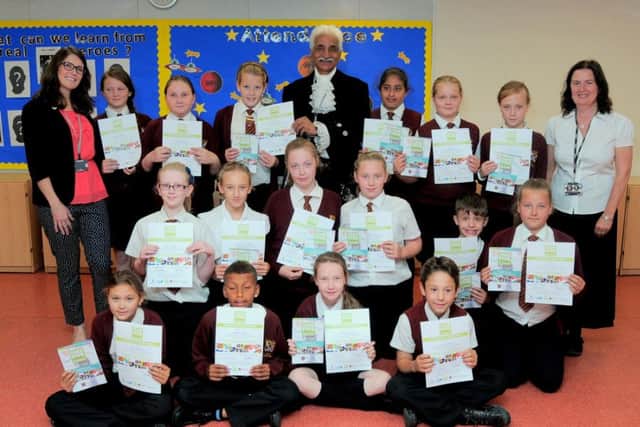 Dr Jas Bilkhu, High Sheriff of Notts, with pupils from Worksop Priory School pic provided by Simon Redfern of Notts county council press office