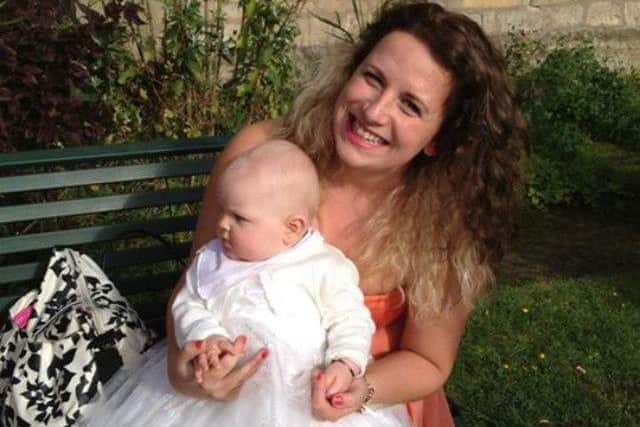 Caitlin with god-daughter Ava at Ava's Christening in 2012.