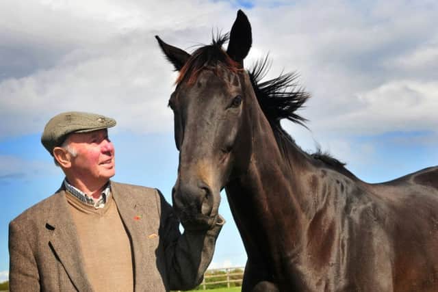 GOING FOR GLORY AGAIN -- owner Trevor Hemmings with Many Clouds after their Grand National triumph in 2015. The nine-year-old has been allocated top weight for this year's race.