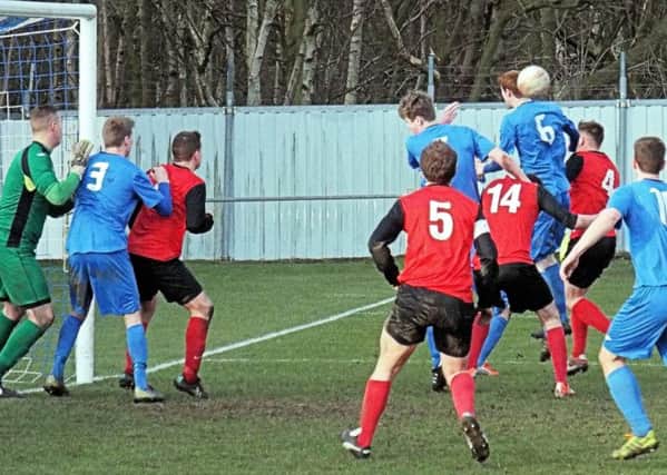 FIVE ALIVE -- action from Teversal's easy 5-0 victory at Rossington Main on Saturday.