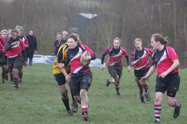 ON THE RUN -- Harry Gibbs surging forward for Ashfield Ladies during their victory.
