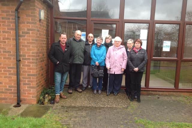 Councillor David Martin with patients at the Underwood GP surgery.