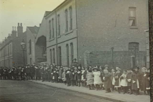 April 1912-  Children on their way to receive a free dinner