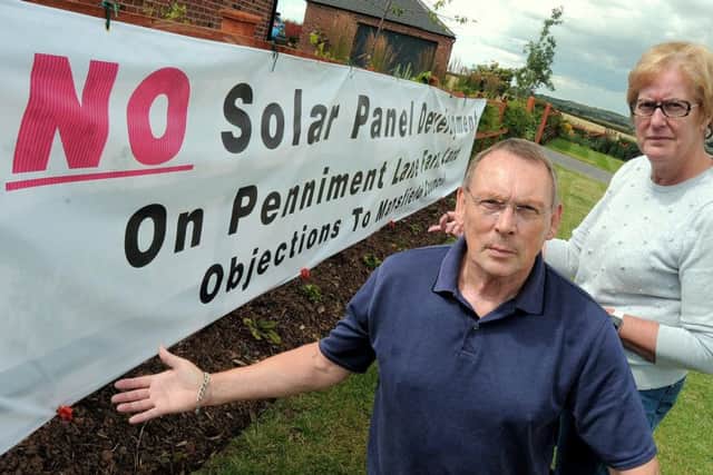 Geoff McCormack & Ann Rose who are amongst the local residents objecting to a planned Solar farm to be erected in fields close to Penniment Lane on the Mansfield / Sutton in Ashfield border.
NMAC 30-7-15 Solar, Solar Farm objectors Geoff McCormack & Ann Rose with the huge Banner on one of their properties to get across their message
( 1 to 4)