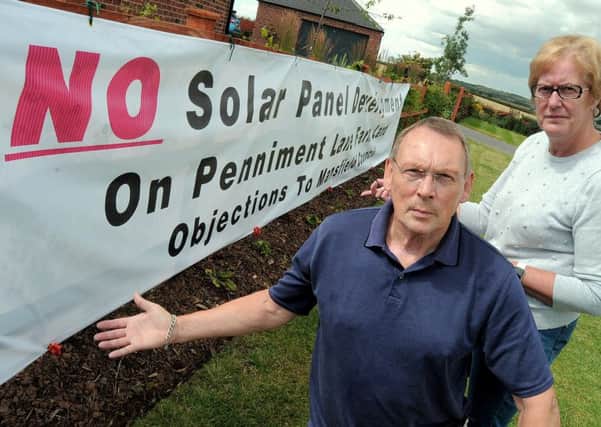 Geoff McCormack & Ann Rose who are amongst the local residents objecting to a planned Solar farm to be erected in  fields close to Penniment Lane on the Mansfield  / Sutton in Ashfield border.

NMAC 30-7-15 Solar, Solar Farm objectors Geoff McCormack & Ann Rose with the huge Banner on one of their properties to get across their message
( 1 to 4)