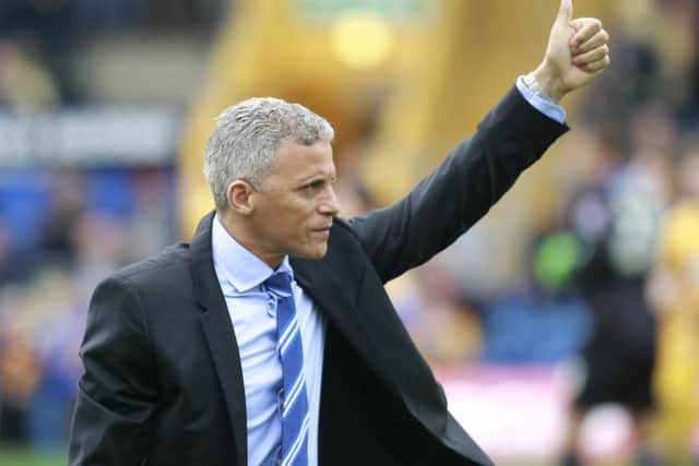 Ex-Mansfield Town boss Keith Curle gives a thumbs up to the home crowd after receiving a round of applause -Pic by: Richard Parkes