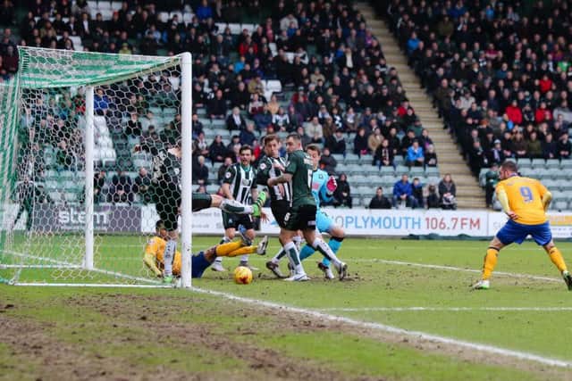 A goalmouth scramble at Plymouth v Mansfield Town - Pic Chris Holloway - The Bigger Picture