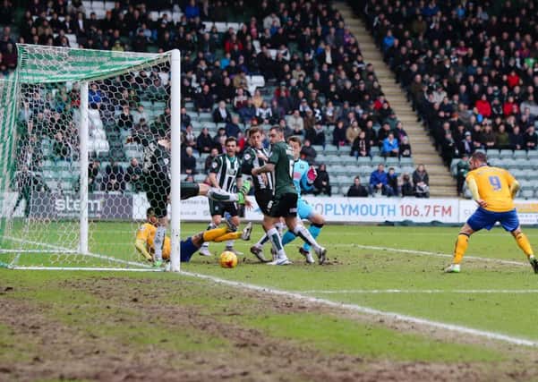 A goalmouth scramble at Plymouth v Mansfield Town - Pic Chris Holloway - The Bigger Picture