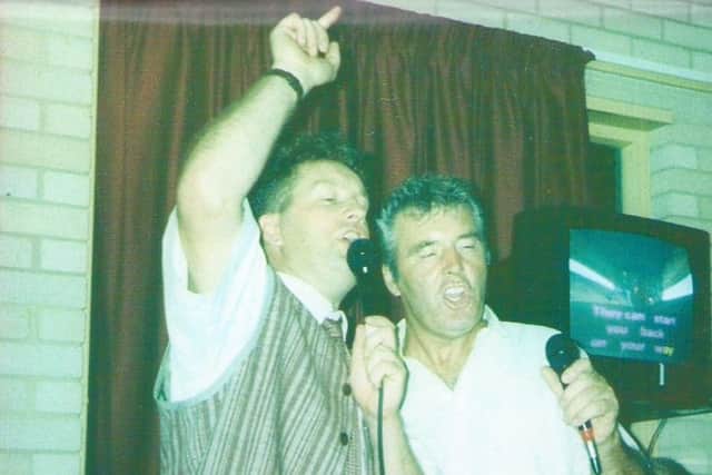Graham Parker and his dad Roy doing karaoke together.