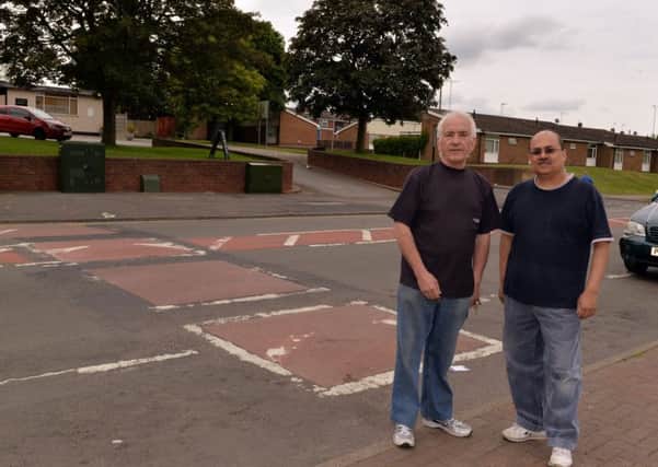 Shop owners on Ladybrook Lane want the speed bumps removing, pictured are Terry Cook and Kalpesh Bhatt