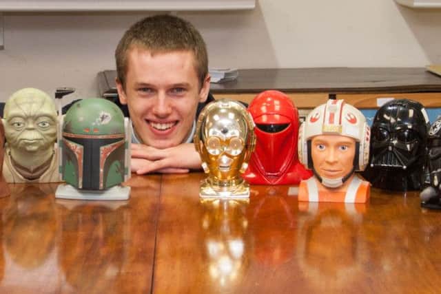 A rare collection of Star Wars toys is set to go under the hammer in Derbyshire next month. Pictured is David Wilson-Turner Hansons Auctioneers' Salesroom Porter with some of the toys.