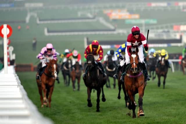 FIRST PAST THE POST -- the kind of thrilling finish to a Festival race up the renowned hill at Cheltenham that helps to make the meeting the highlight of the year for so many racing fans. (PHOTO BY: rossparry.co.uk/mikal ludlow).