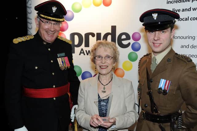 Chad Pride Awards.        Jane Thacker received her award for Outstanding Bravery from Colonel (Rtd) David Sneath, left, and Capt. Lloyd Watts.