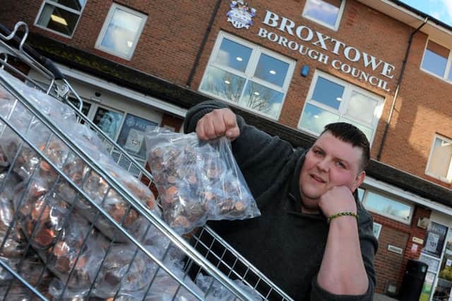 Russell Skellett delivers Â£1,850 in pennies to Broxtowe Borough Council offices to pay council tax on two properties that he owns.