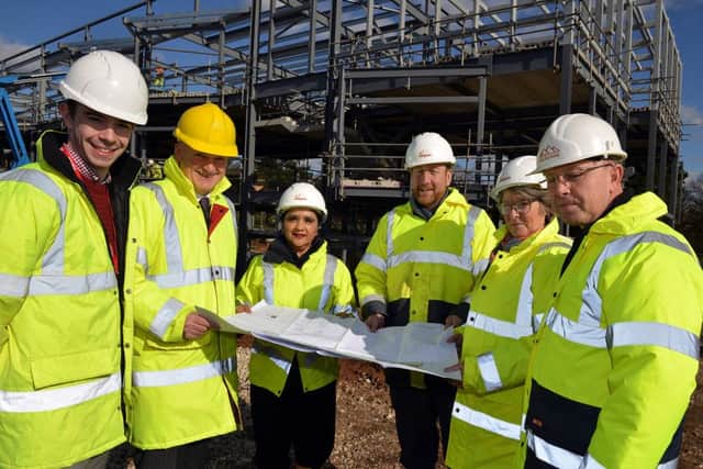 College chiefs and business leaders check progress on the new Â£6.5m Vision University Centre being constructed at West Nottinghamshire Colleges Derby Road campus, pictured are David Ralph, Chief Exec D2N2, Dame Asha Khemka, West Notts Principal and Chief Exec, Tom Stevens, Direct Capitol Projects, Gary Hallam, contract manager for Wild Goose and Simon Barlow IBI architect