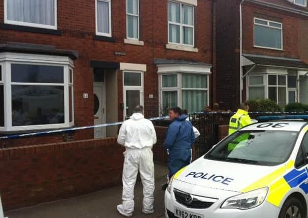Police on Station Road, Shirebrook, during an investigation into the deaths of two women.