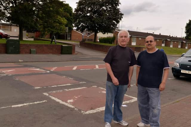 Ladybrook Lane shopkeepers  Terry Cook and Kalpesh Bhatt, have been campaigning to have the bumps removed.