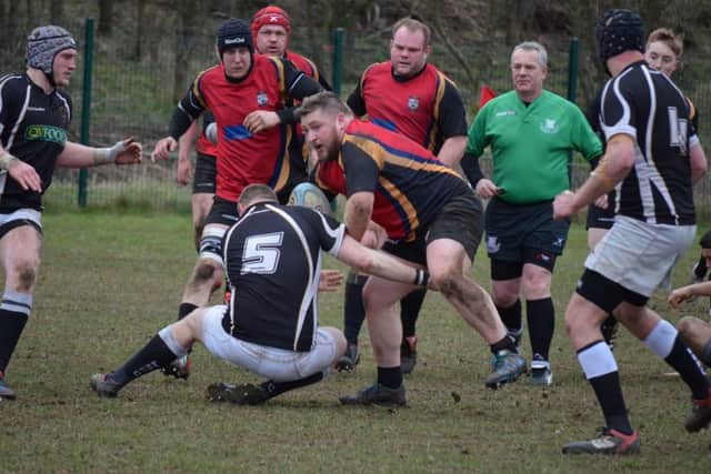 ON THE CHARGE -- Chris Houseman tries to get Ashfield RUFC going.