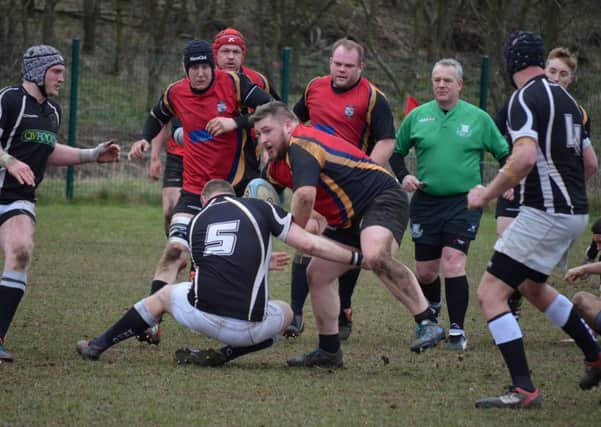 ON THE CHARGE -- Chris Houseman tries to get Ashfield RUFC going.