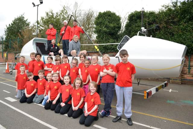 Children at Morven Park Primary School with teacher Sam Geeson, Endurance rowing team, Darren Clawson, Matt Knight and Arron Worbey and headteacher Mark Watson