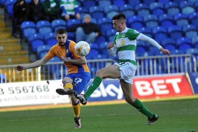 Daniel Alfei clears for Mansfield against Yeovil. Photographer: Steve Uttley