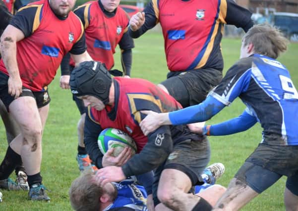 STOPPED IN HIS TRACKS -- Daz Jones feels the full force of the Grimsby opposition during depleted Ashfields 33-3 defeat in the National Leagues Midlands 3 East (North) division last Saturday when a host of injuries caught up with them.