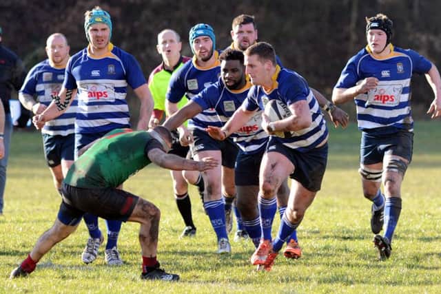 ON THE RUN -- Mansfield applying more pressure on their title-chasing visitors, Dronfield.