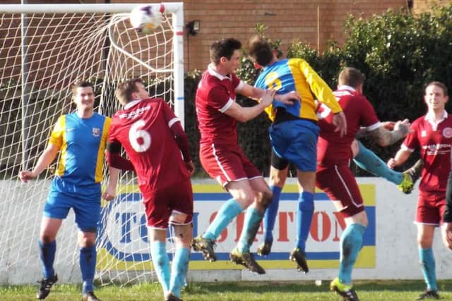 GOALMOUTH ACTION -- it's all hands to the pump as Teversal defend a set-piece in their victory at Lincoln Moorlands Railway on Saturday.