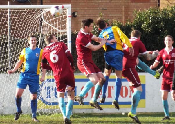 GOALMOUTH ACTION -- it's all hands to the pump as Teversal defend a set-piece in their victory at Lincoln Moorlands Railway on Saturday.